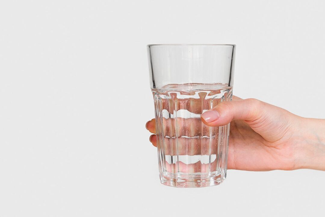 A cup of water for diluting powder Keto Probiotix